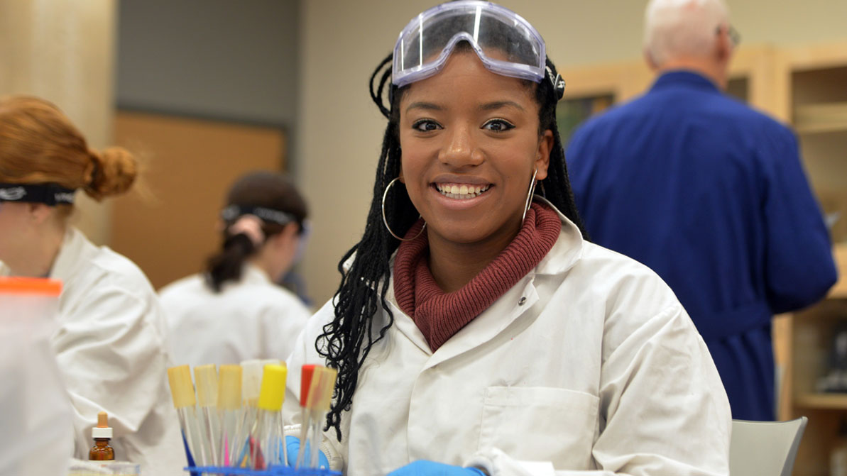 A female student in a scientific lab environment